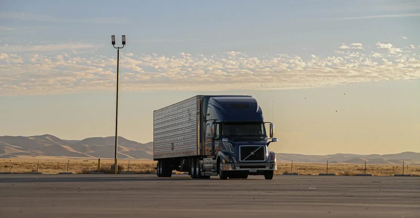 A black moving truck on the road